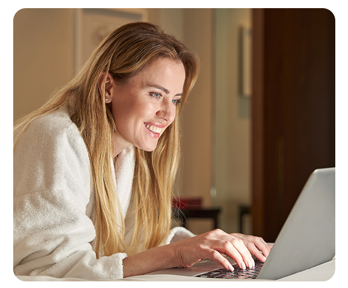 Lady on Laptop in hotel room
